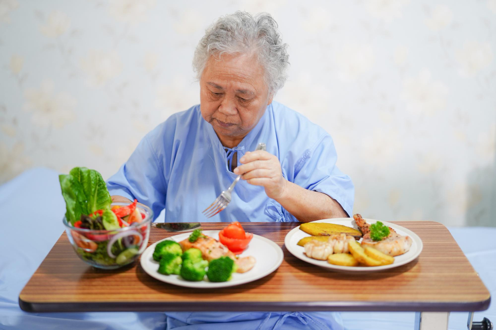 a old man that understands nutrition and wound care sitting eating healthy foods