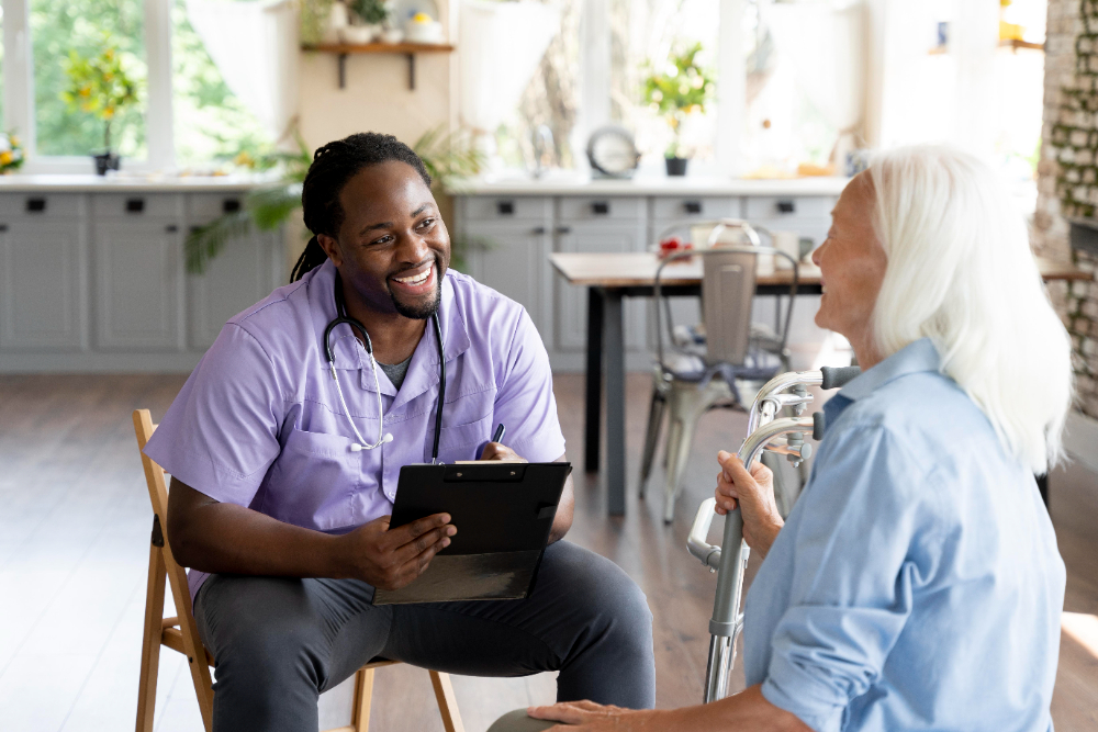 wound care doctor sitting and smiling while speaking with a patient at a wound care clinic